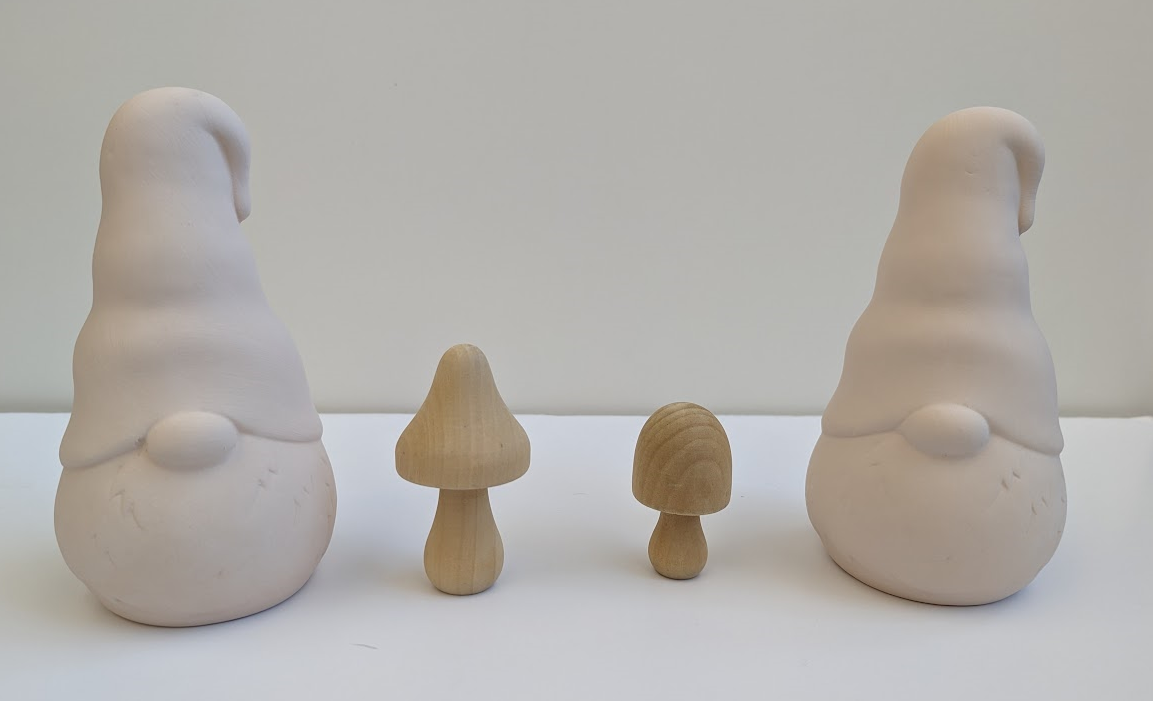 Gnome and mushroom crafts available for painting.