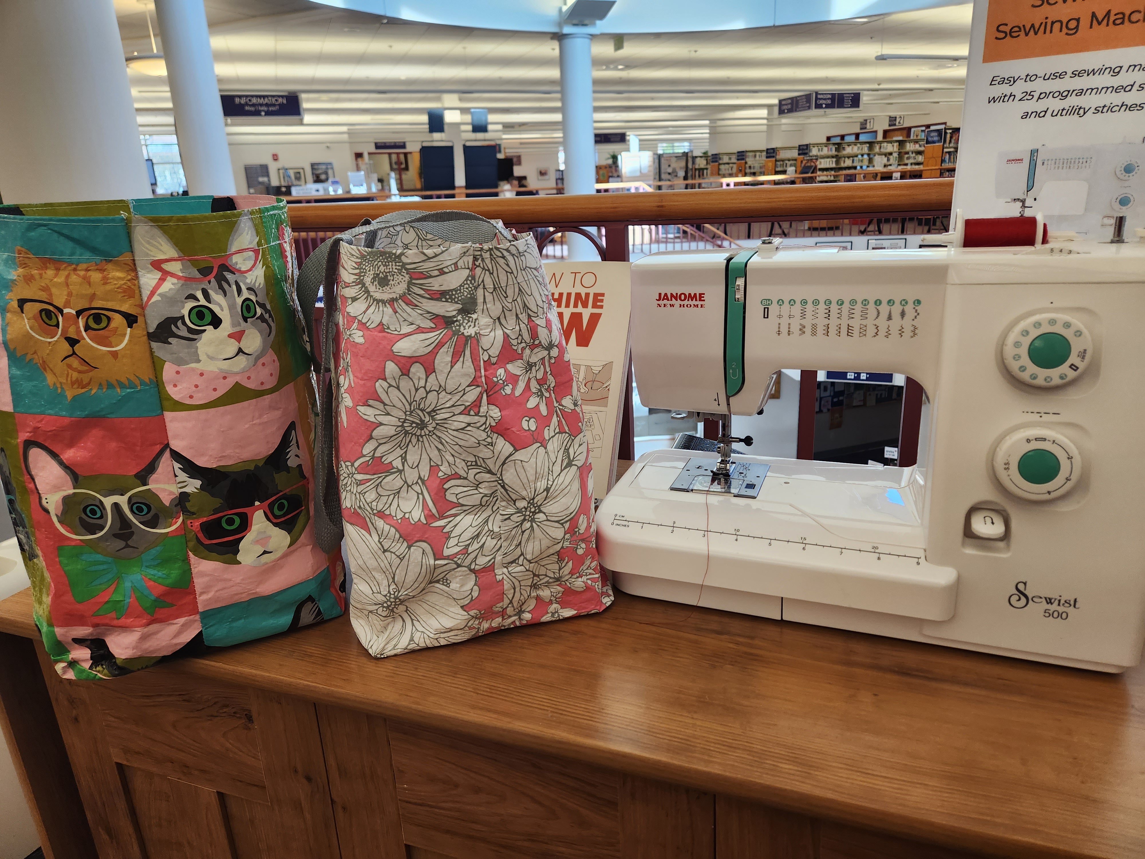 upcycled totes and sewing machine in the library