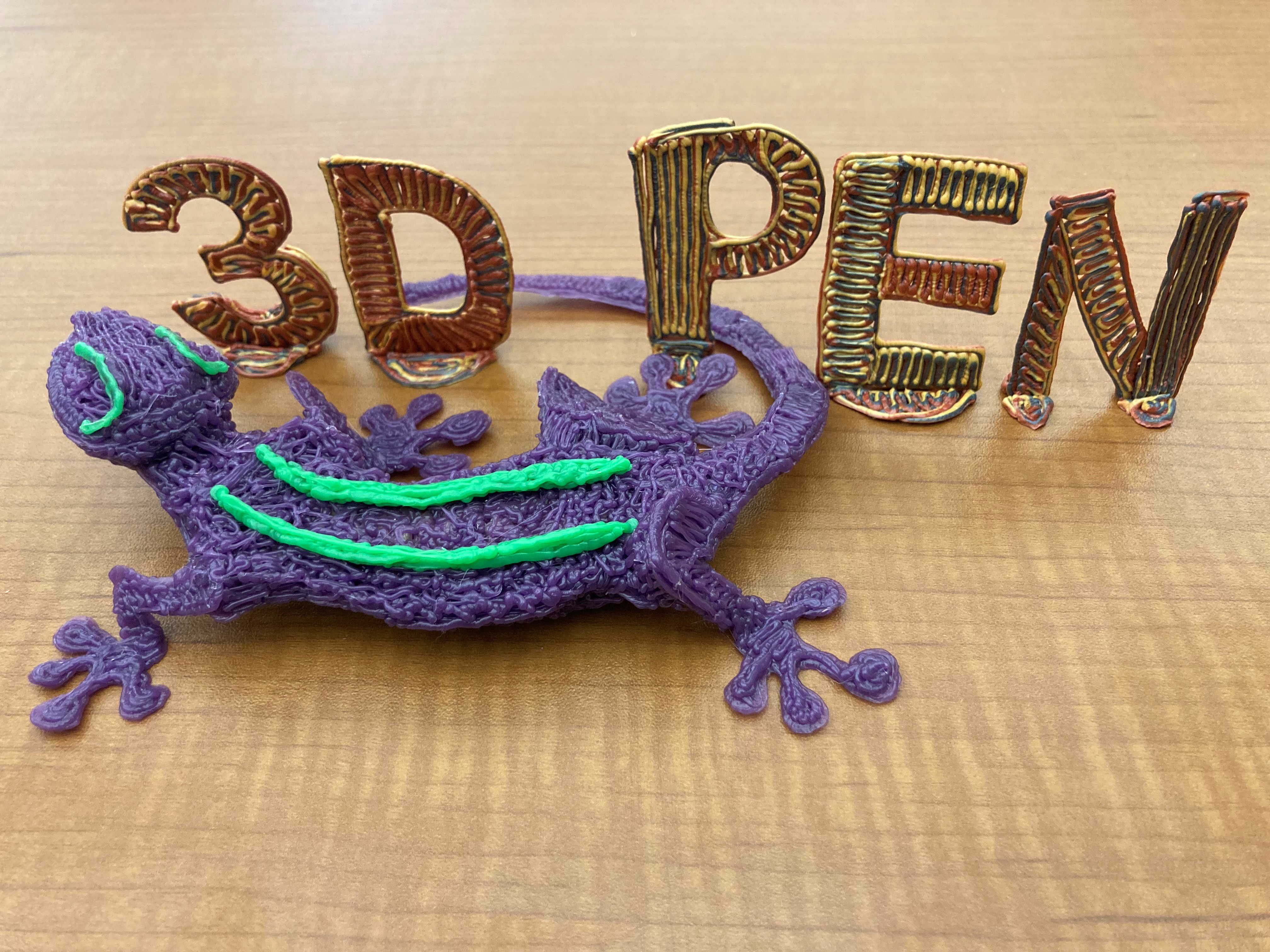 3 dimensional text that reads "3 D P E N" behind a 3 dimensional lizard made from PLA filament