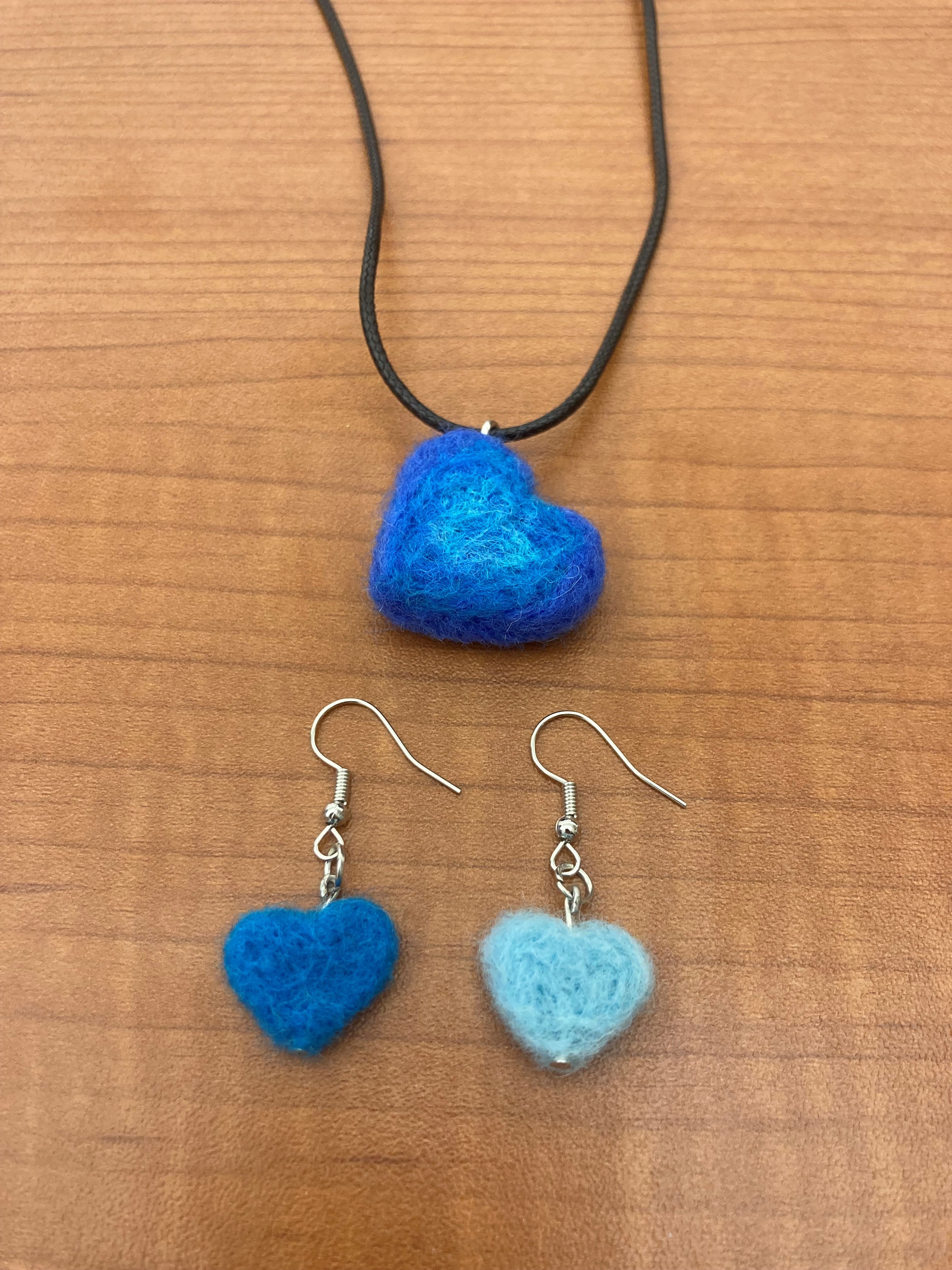 Blue felted wool heart shaped earrings and necklace.