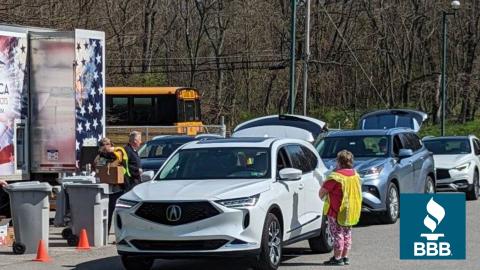 Cars in a line to drop of materials to be shredded