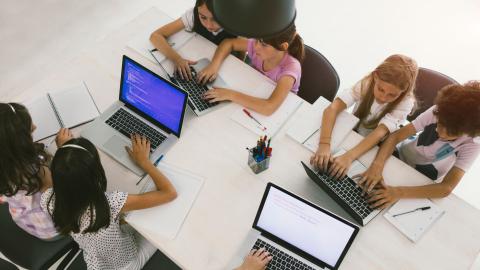 children doing work on computers