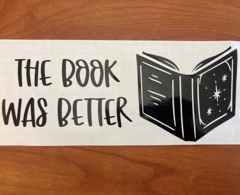 Vinyl sticker with a picture of a book and text that reads "the book was better"