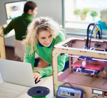 Woman using a 3D printer