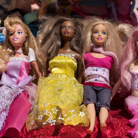 decorative image of Barbie dolls