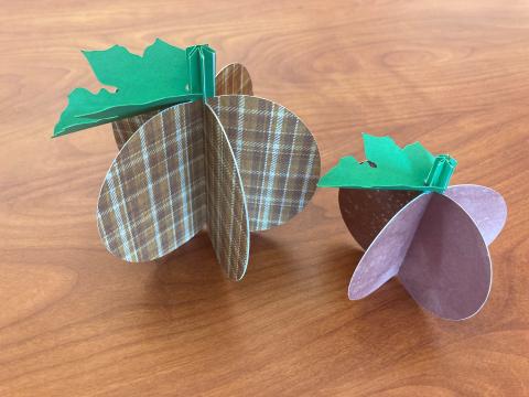 Two 3D paper pumpkins with leaves