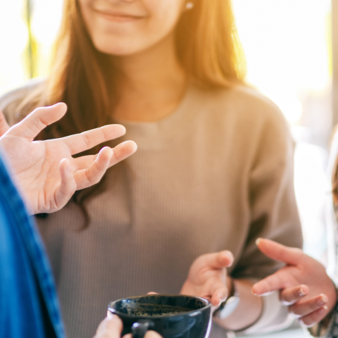 decorative image of people talking over coffee