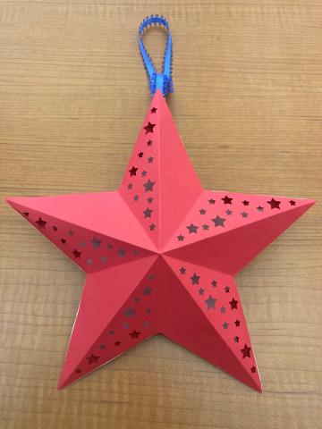 red, white, and blue cut paper lantern
