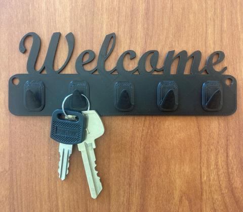 3D printed key hanger that says "Welcome"