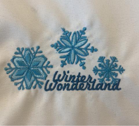 Embroidered snowflakes with the words "winter wonderland"
