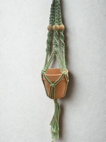 Macrame plant hanger with terra cotta pot