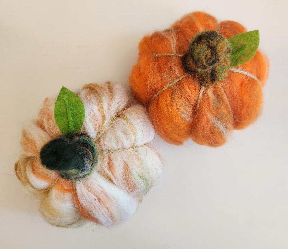 two felted pumpkins