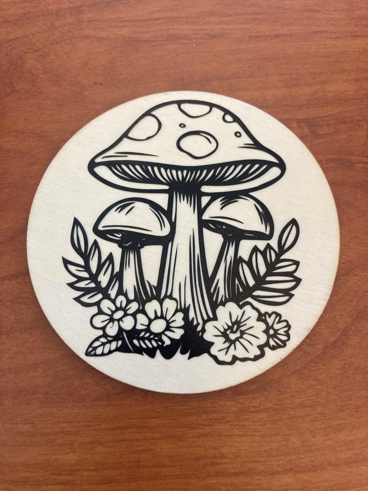 Wood coaster with vinyl sticker of a mushroom