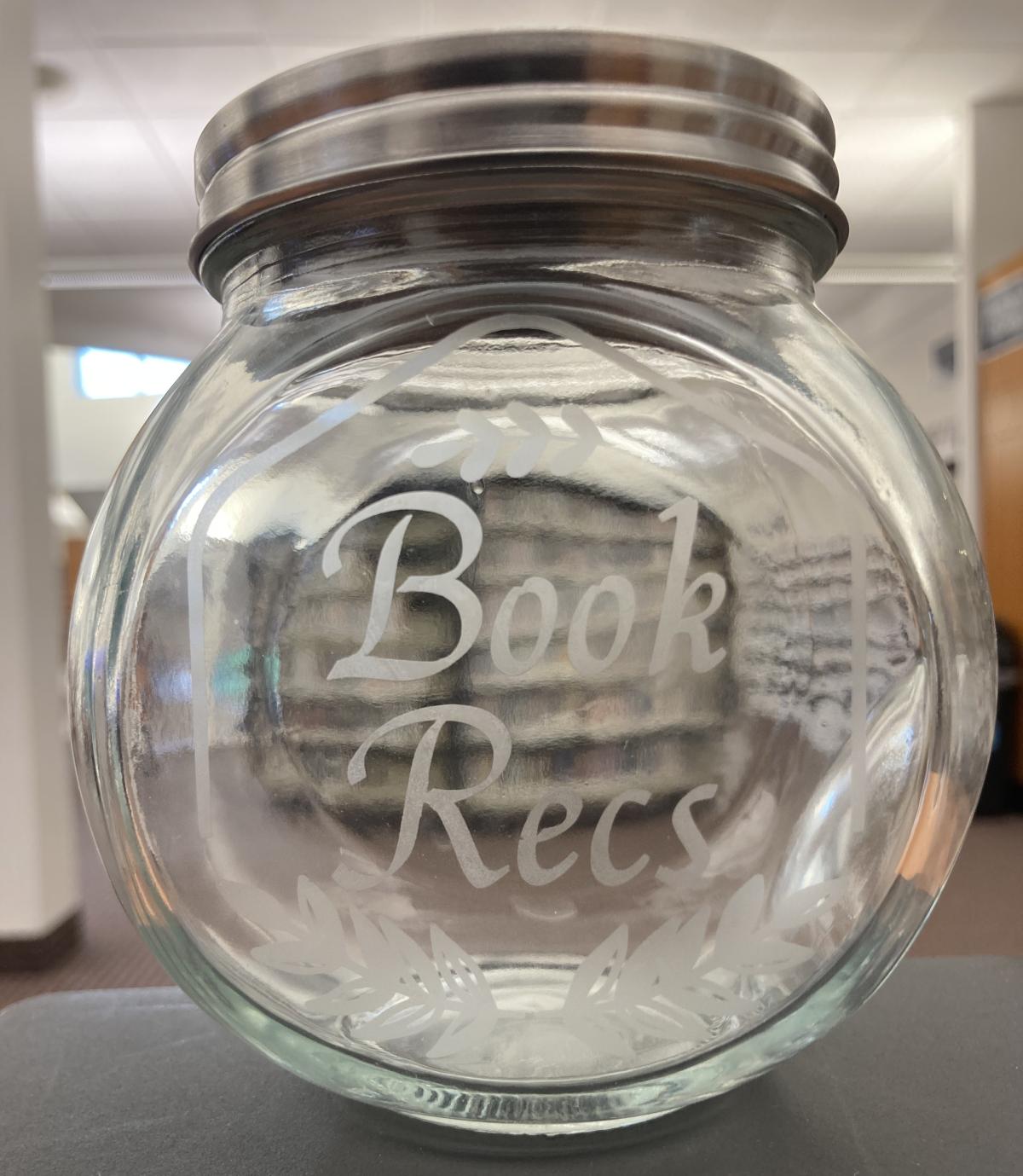 Glass jar with etched design