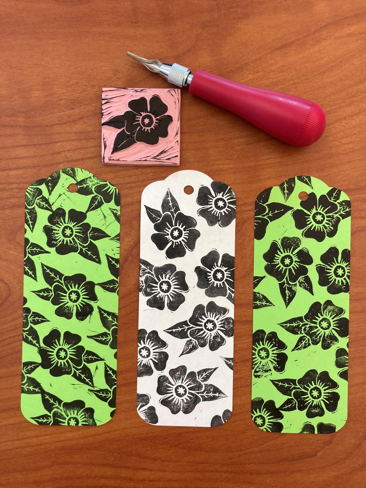 Carved rubber stamp, Speedball carver, and 3 printed bookmarks