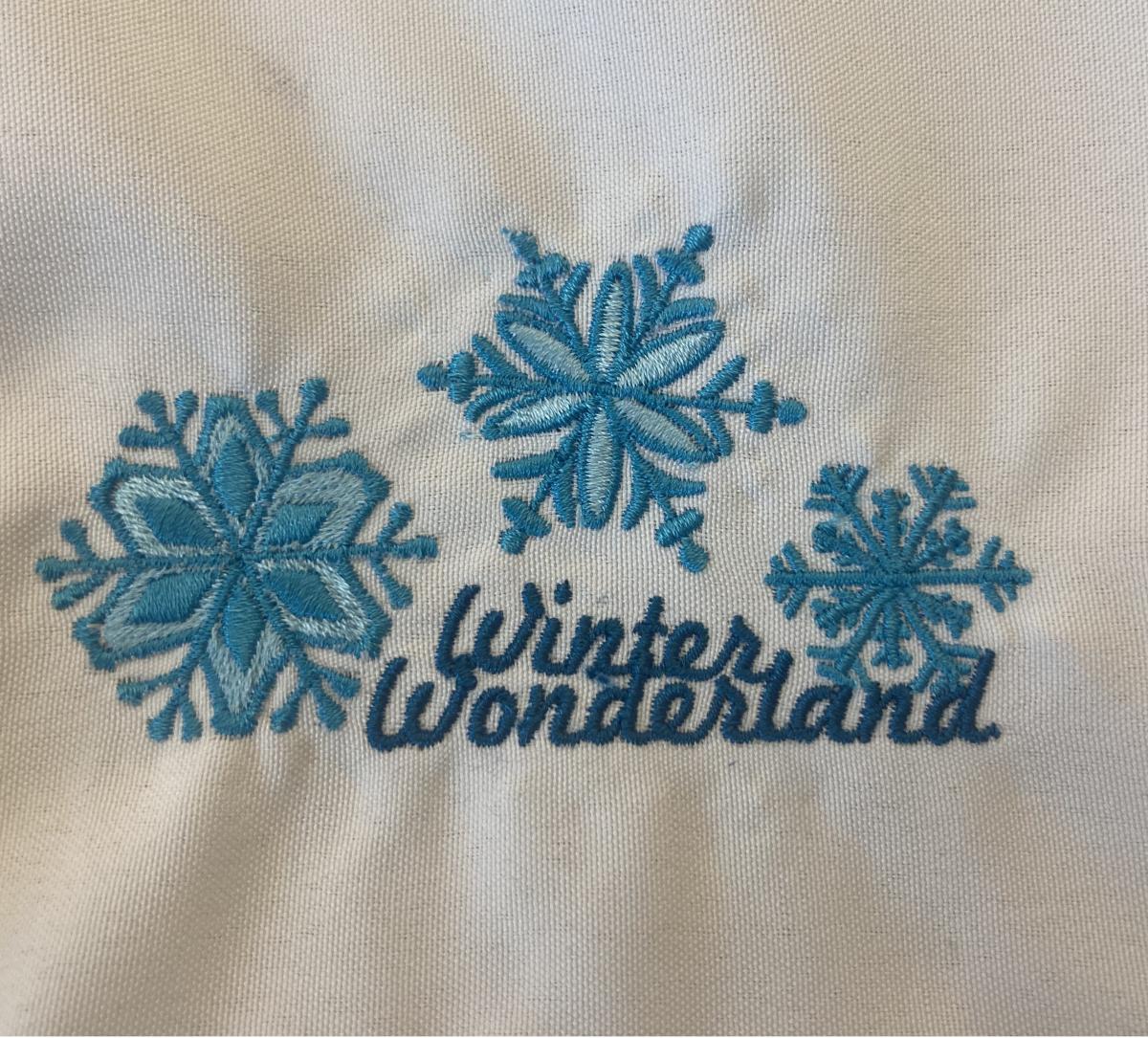 Embroidered snowflakes with the words "winter wonderland"
