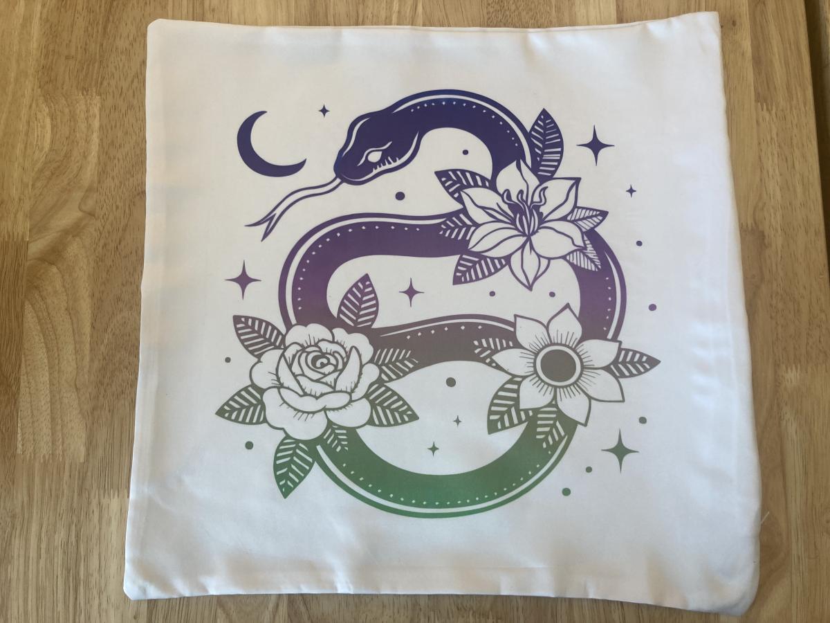 pillow cover with a snake and flowers on it